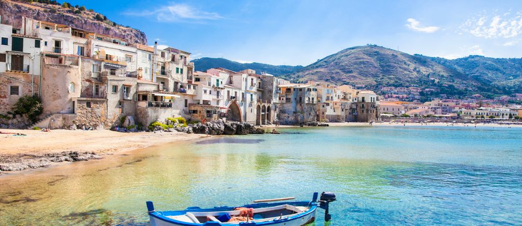 Old Harbour with fishing boat in Cefalu