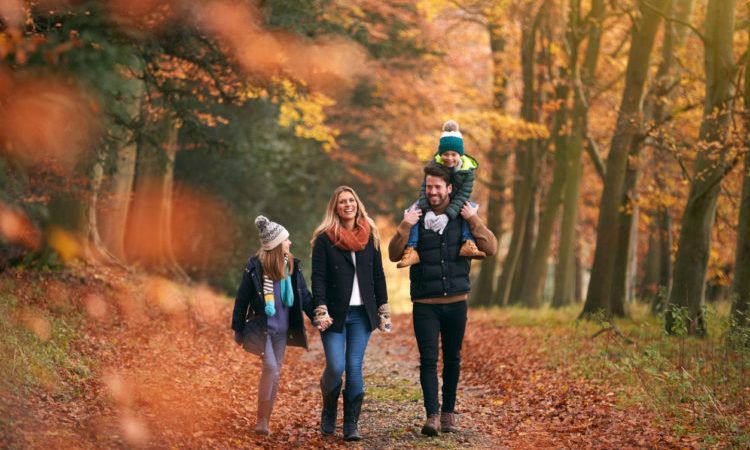 family walking in autumn