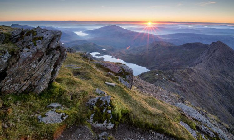 An amazing sunrise over the Snowdonia national park as view from the summit of Snowdon on a cold Octobers morning.