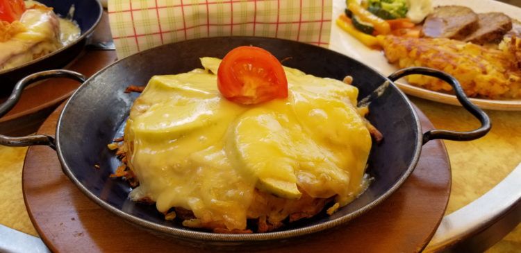 Traditional Welsh dish made with savory sauce of melted cheese poured over toasted bread served in a chafing dish.