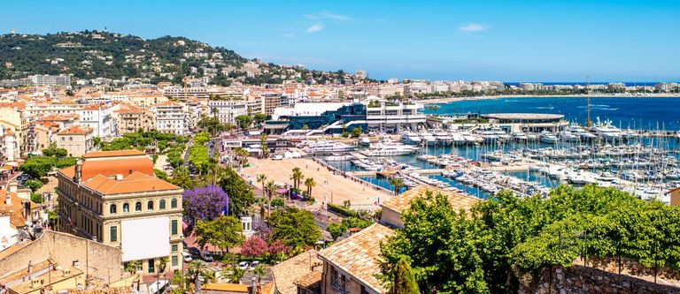 Top cityscape view on french riviera with yachts in Cannes city