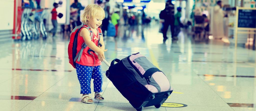 little girl with suitcase travel in the airport, kids travel