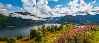 Early morning at Loch Duich in the Highlands of Scotland with low lying clouds and mountain views