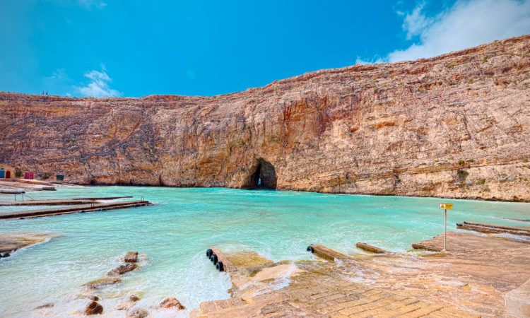 blue water in a bay in gozo