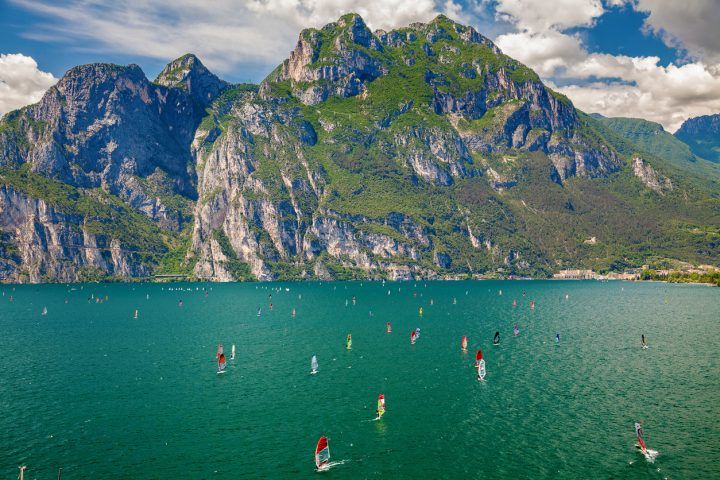 Windsurfers Surfing On A Garda Lake
