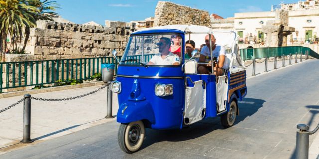 Family on a tricycle in Sicily