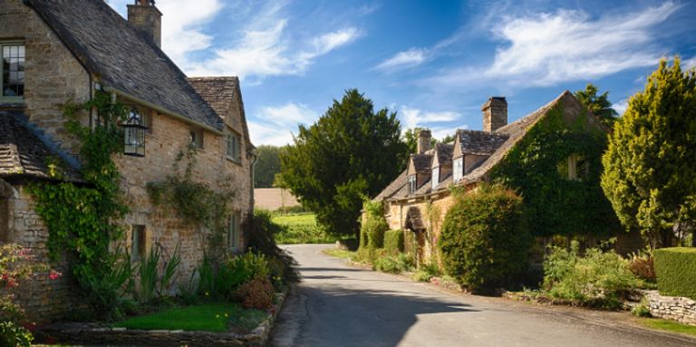 Street of old houses in the Cotswolds UK