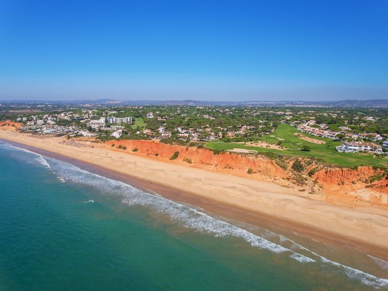 Aerial view of the beach and golf courses in Vale De Lobo.