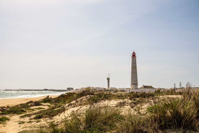 Beach, Dunes And Lighthouse