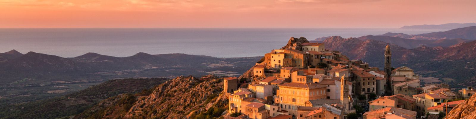 Sunset buildings on a hillside in Corsica