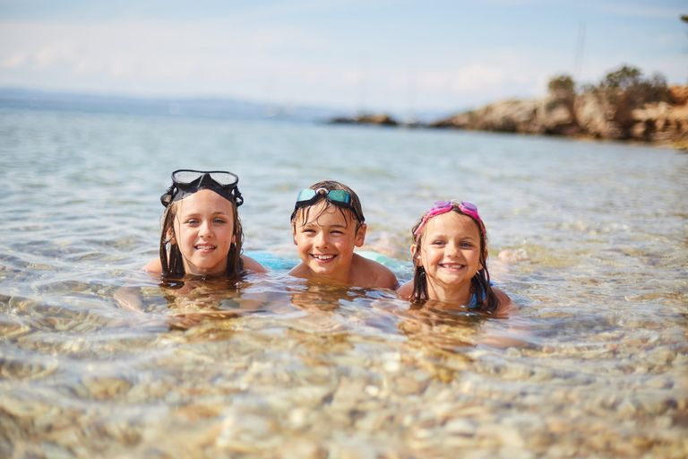 Three children in the sea