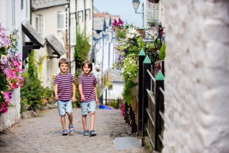 Children walking through a village