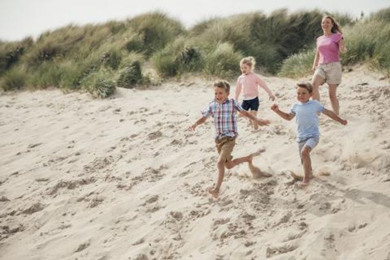 Children playing in the sand dunes