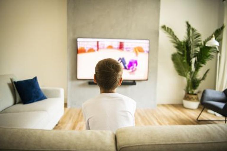 young boy watching tv