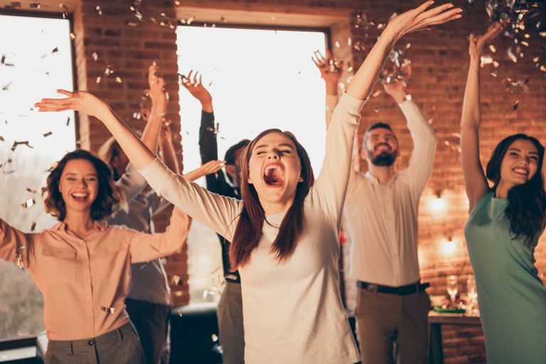 Close up photo yelling loud friends event hang out dancing drunk birthday sing singer hands arms raised up she her ladies he him his guys wear dress shirts formal wear glitter loft room indoors.