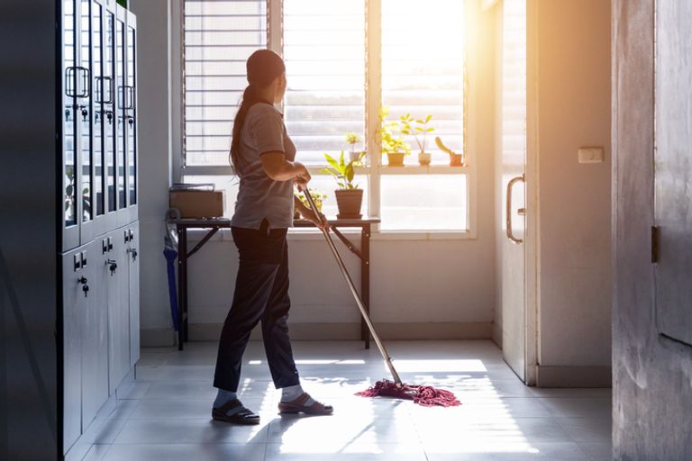 Housekeeper mopping