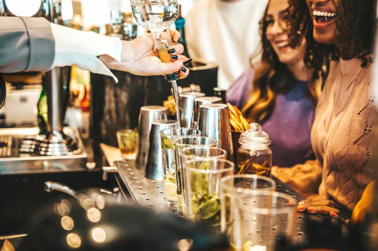 mixologist creating cocktails for guests
