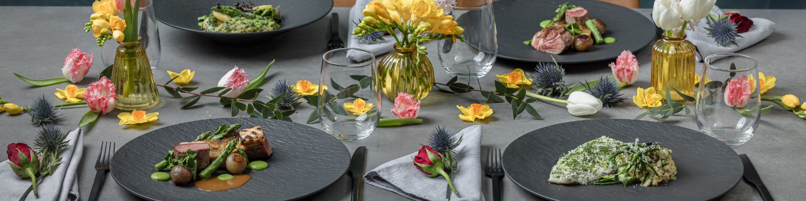 Food plated up at decorated dinner table
